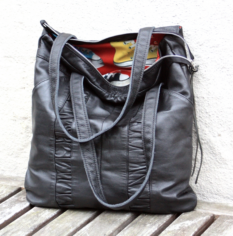 Black leather city bag made of a pair of trousers