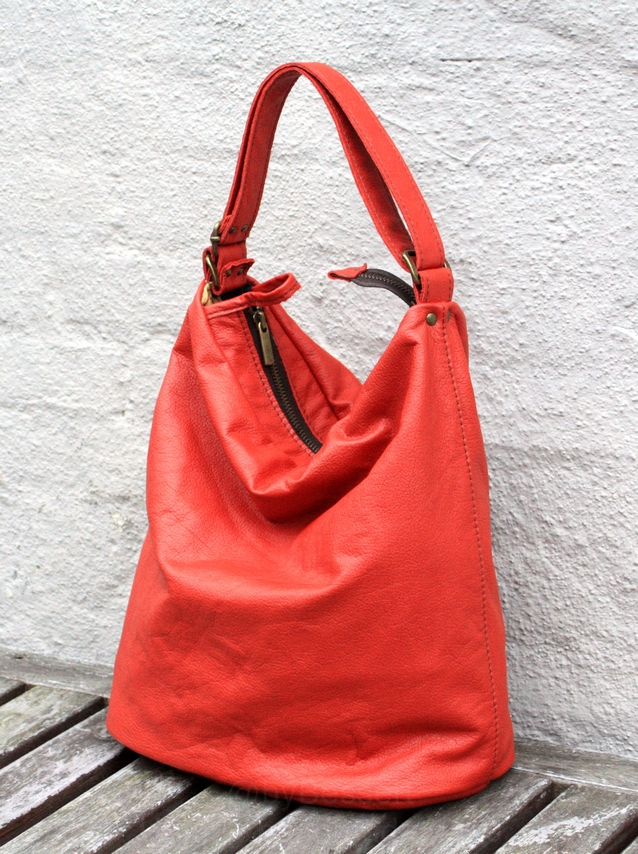 A rusty-orange leather bag